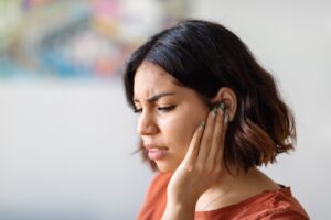 Ears Pain. Sick Young Arab Woman Suffering From Earache At Home